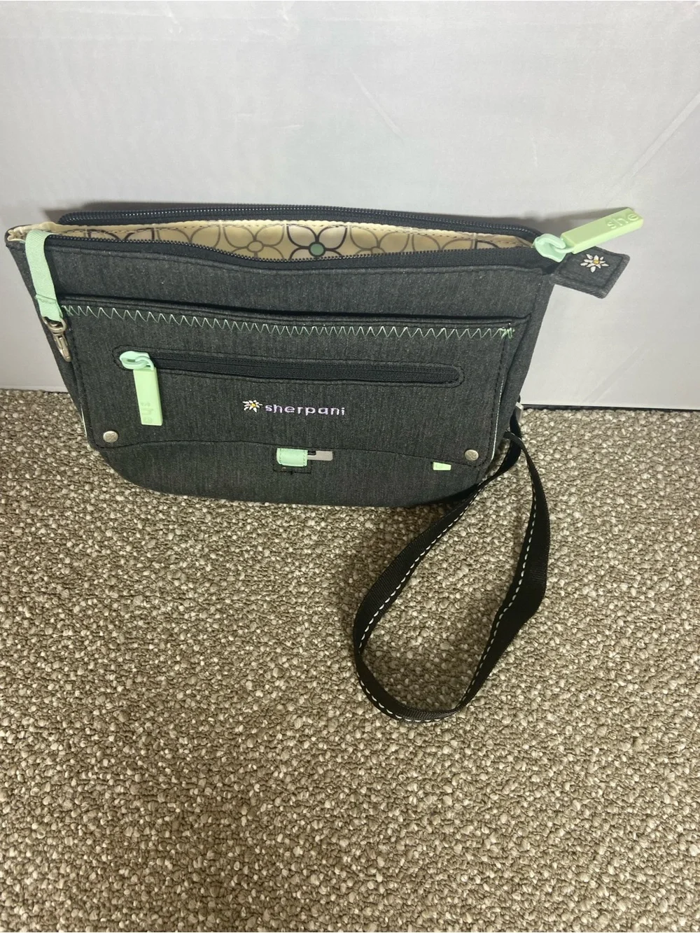 Sherpani Black Crossbody with Mint Trim.Pre-Owned Little small stain,Like New.